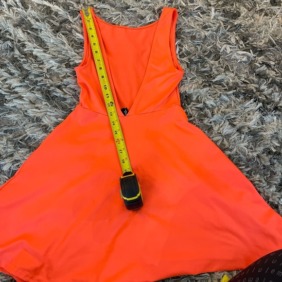 Bright orange mini dress with flared skirt and backless design - Picture 8 of 9